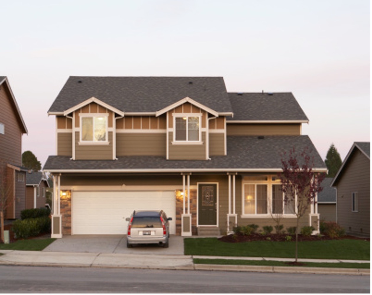 Front view of house with car in driveway